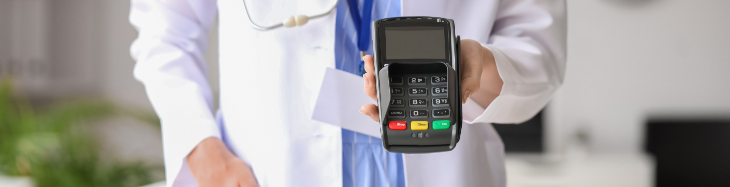 doctor with a credit card processing machine