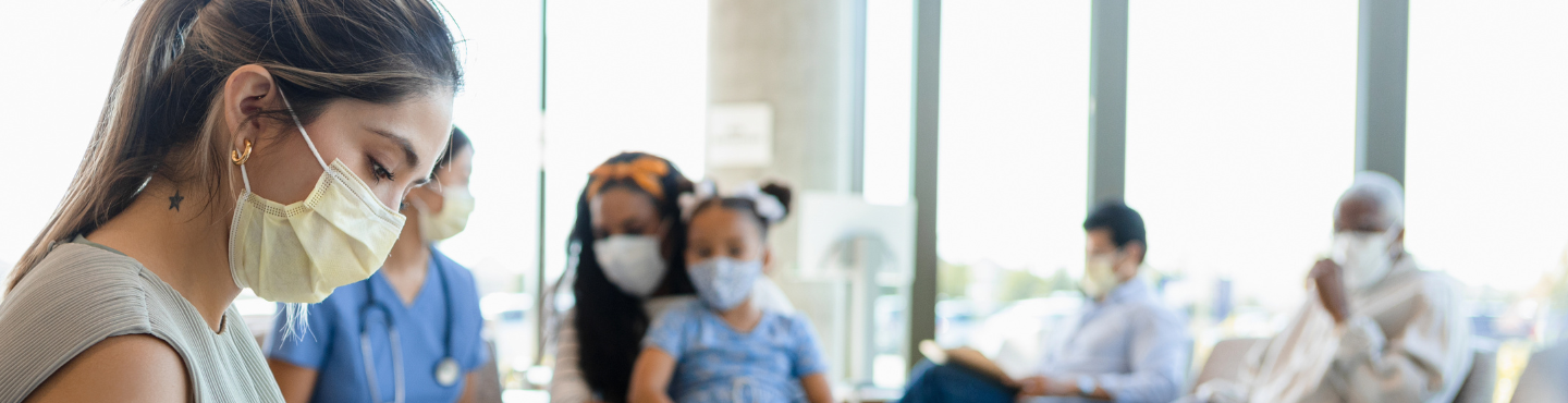 woman in waiting room wearing a mask